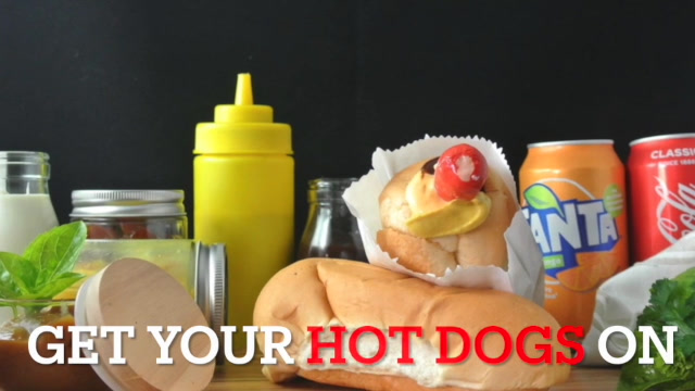 Get your hot dogs on — product showcase with mustard, Fanta, and fresh herbs