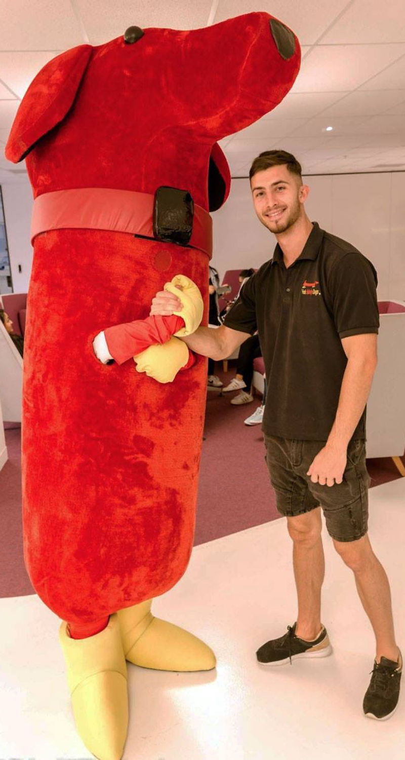 Max with the Hot Didely Dogs mascot in the famous hot dog suit